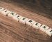 Scrabble Tiles Forming Pinterest Word on Brown Wooden Surface